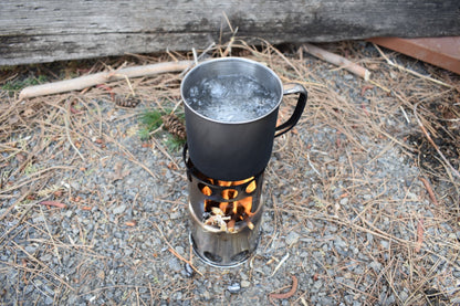 Bio Fuel Stove metal camping stove by River Country Gear with boiling water in pot on Tampa Home & Garden Store