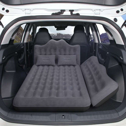 Umbrauto backseat air mattress in black with two pillows laid across SUV rear seats on Tampa Home & Garden Store