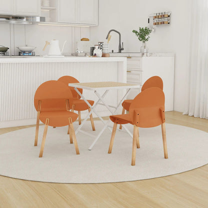 4-piece orange folding chairs with white square table set in kitchen by Unique Piece Furniture on Tampa Home & Garden Store
