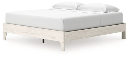 Socalle Platform Bed by Unique Piece Furniture, light wood frame with white bedding on Tampa Home & Garden Store