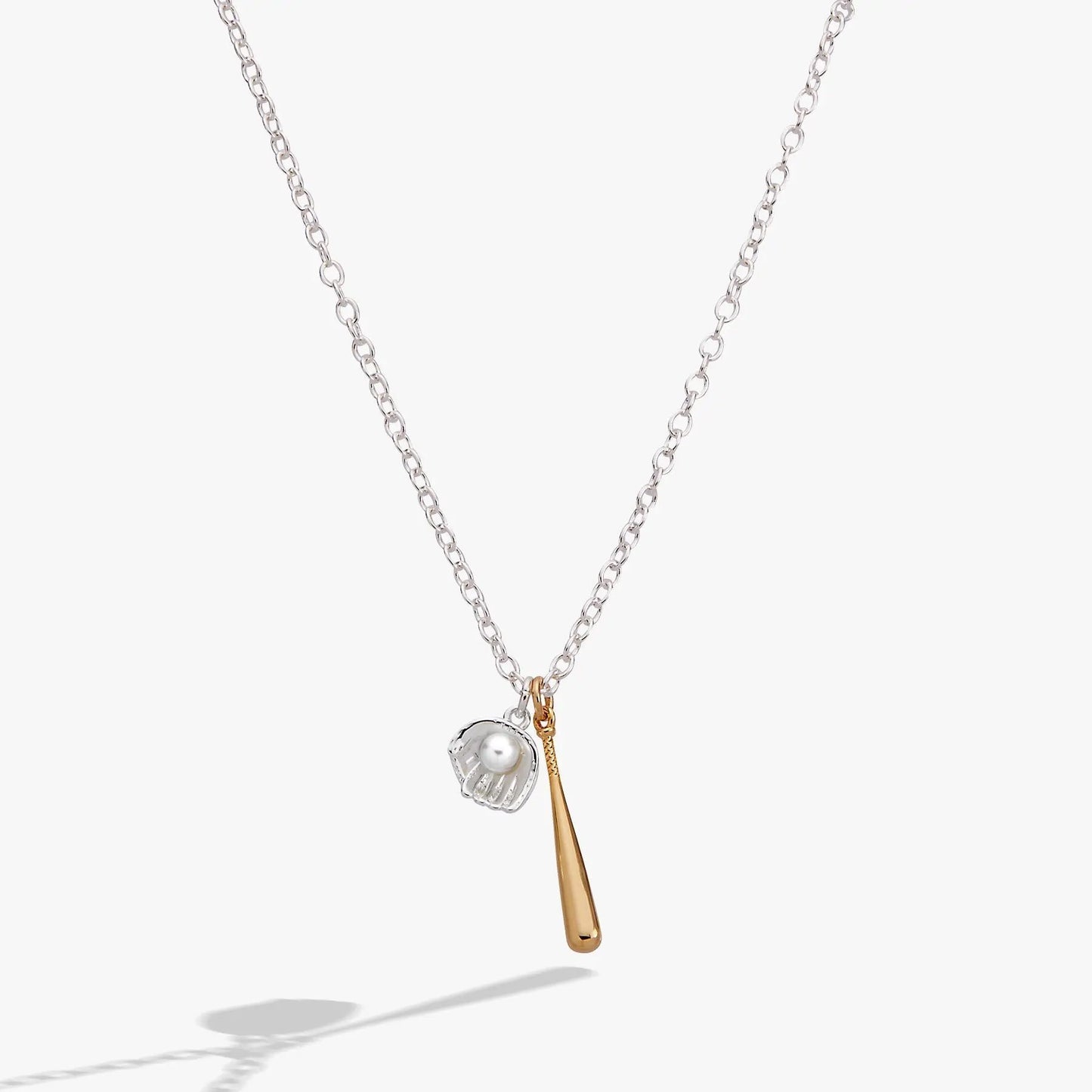 Ballgame Duo Charm Pendant Necklace by ALEX AND ANI; chain with a ball cage charm and gold-tone tassel on Tampa Home & Garden Store