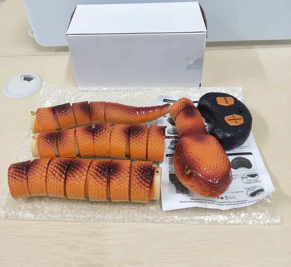 Smart Sensing Cat Snake Toy with orange segments and black remote USB rechargeable pet toy on Tampa Home & Garden Store
