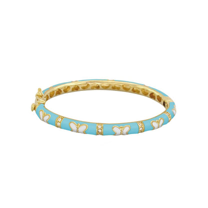 Petite Butterfly Bangle in turquoise enamel with white butterfly motifs and gold accents on Tampa Home & Garden Store