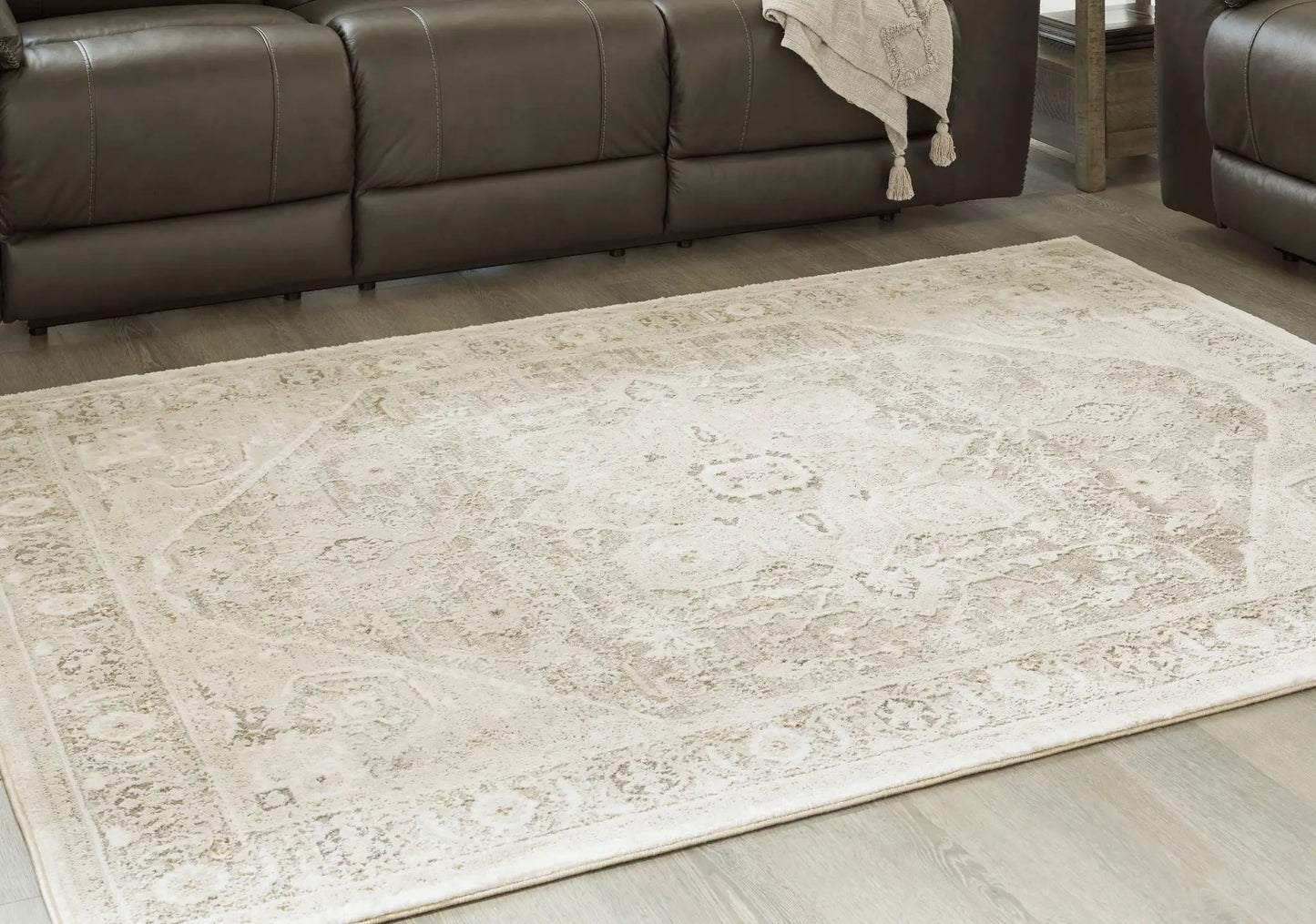 Gatwell rug beige patterned area rug with cream motifs on wood floor on Tampa Home & Garden Store