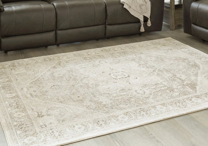 Gatwell rug beige patterned area rug with cream motifs on wood floor on Tampa Home & Garden Store