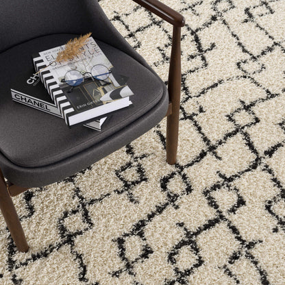 Pahala Moroccan Shag Area Rug beige cream with black geometric pattern in living room on Tampa Home & Garden Store