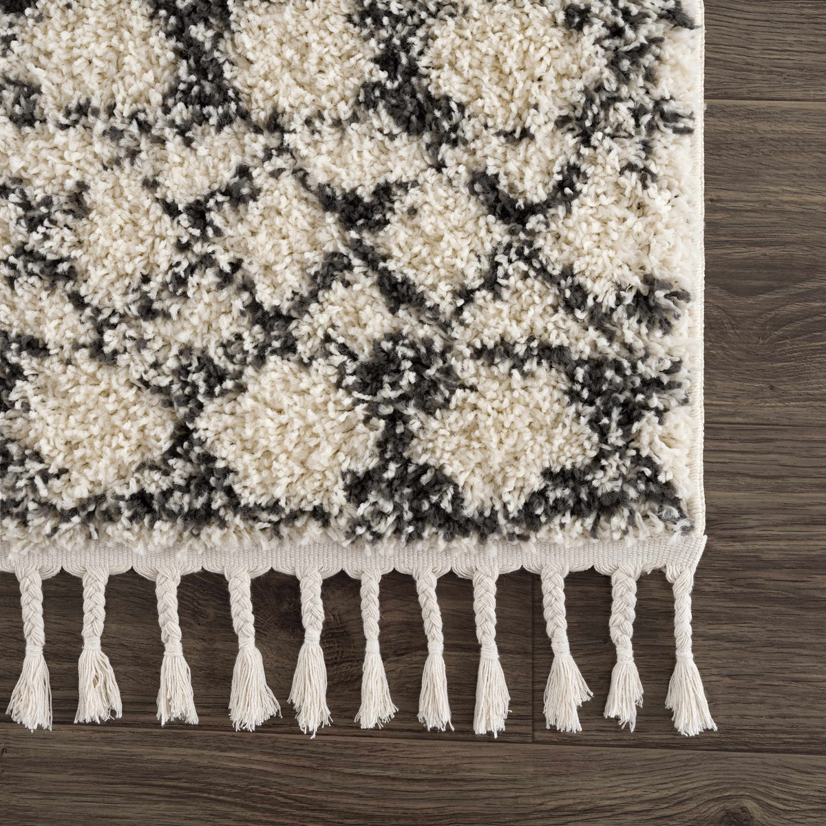 Buan area rug by Boutique Rugs, cream and gray shag with black accents and tassel fringe on Tampa Home & Garden Store