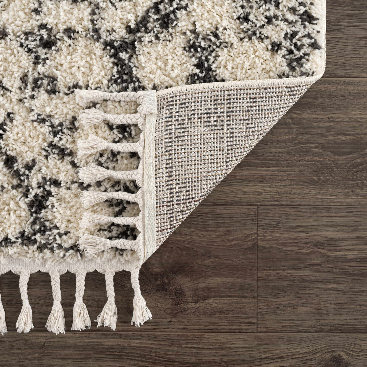 Buan Area Rug by Boutique Rugs, cream and black shag with tassel fringe on Tampa Home & Garden Store