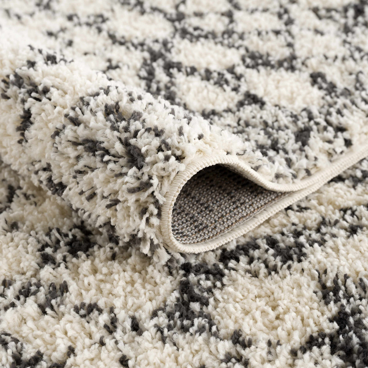 Buan Area Rug by Boutique Rugs, ivory and gray shag with plush pile on Tampa Home & Garden Store