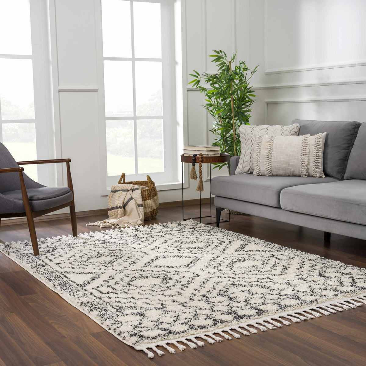 Buan Area Rug by Boutique Rugs in cream with black abstract pattern and tassel fringe on Tampa Home & Garden Store