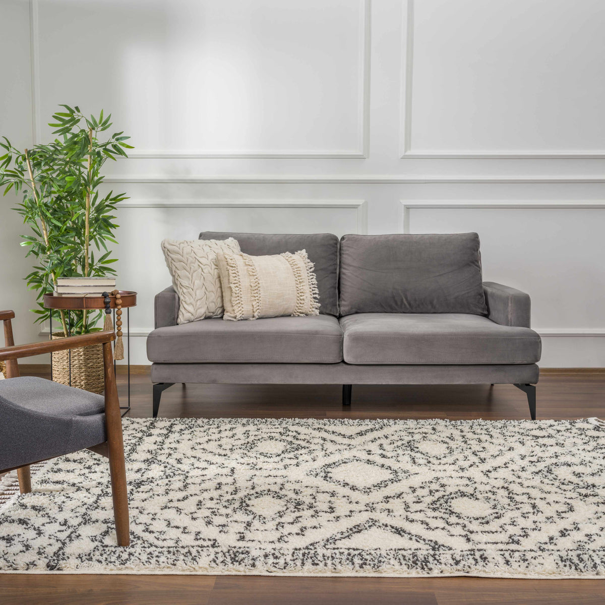 Buan Area Rug black white speckled pattern in a contemporary living room with a gray sofa on Tampa Home & Garden Store