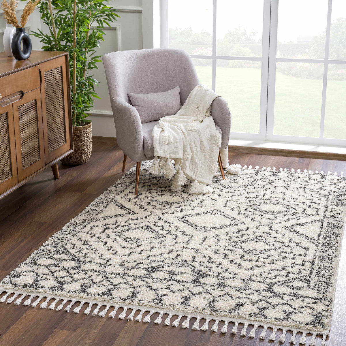 Buan Area Rug cream with black geometric border and tasselled fringe on Tampa Home & Garden Store