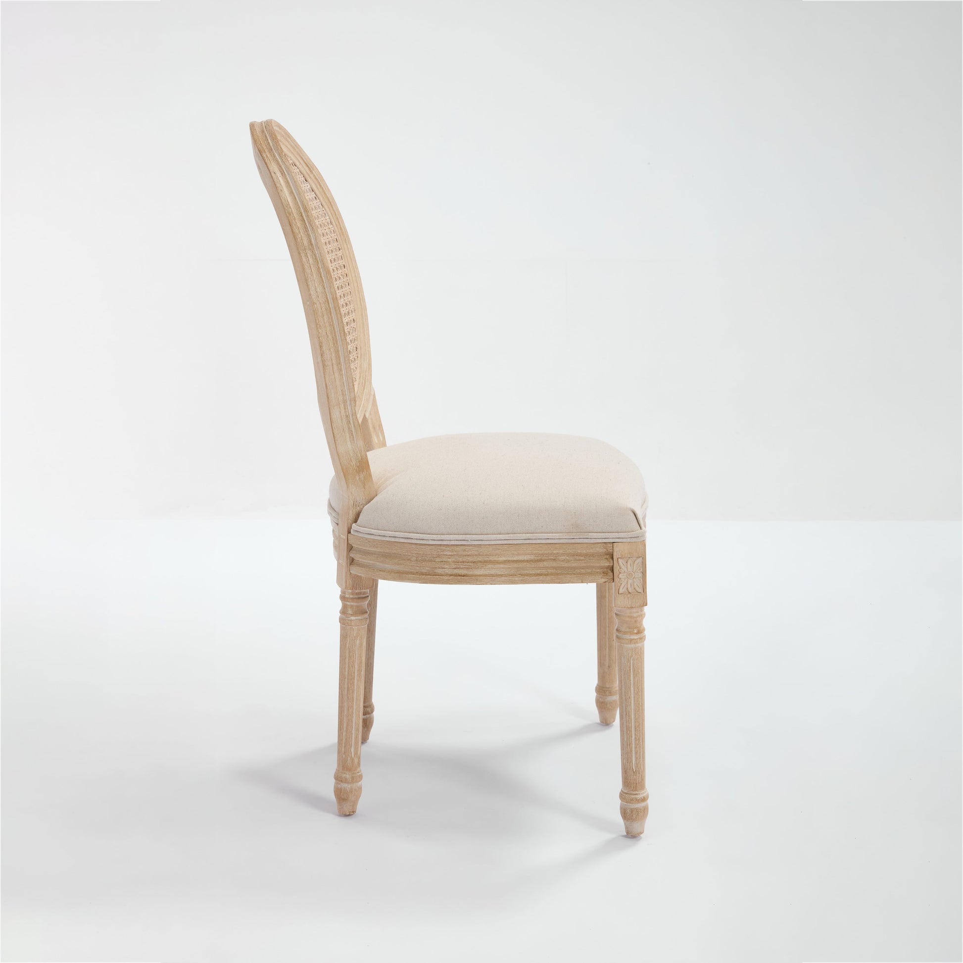 French Country dining chair with upholstered beige seat and woven rattan back on Tampa Home & Garden Store