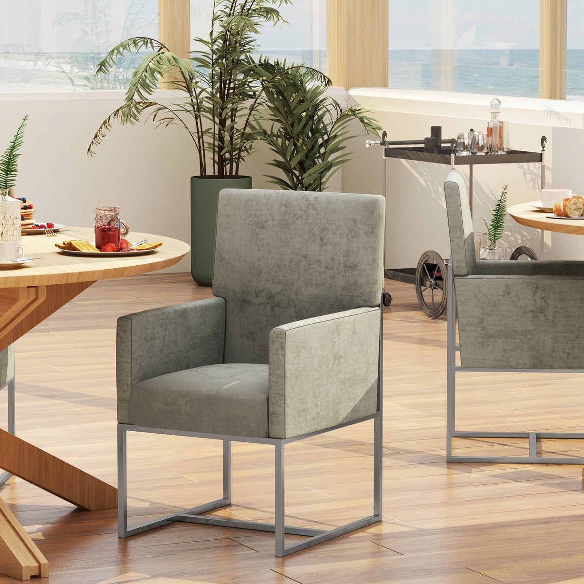 Element Dining Arm Chairs in gray upholstery with slim metal base by HouseOfZazla on Tampa Home & Garden Store