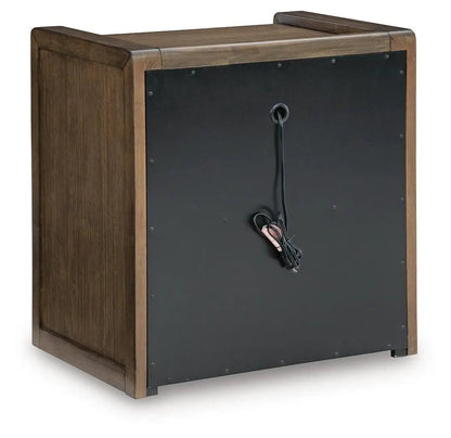 Marxmore Three Drawer Night Stand in brown wood with black back panel and exposed cord on Tampa Home & Garden Store