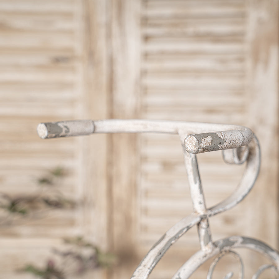 Rustic bicycle-shaped metal wire wall planter basket with distressed white finish on Tampa Home & Garden Store