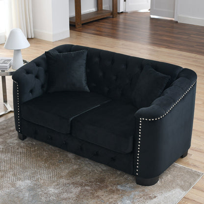 Modern Chesterfield sofa with tufted backrest in black velvet, nailhead trim along arms on Tampa Home & Garden Store
