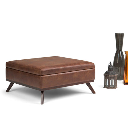 Owen multifunctional square coffee table storage ottoman in brown faux leather with angled legs on Tampa Home & Garden Store