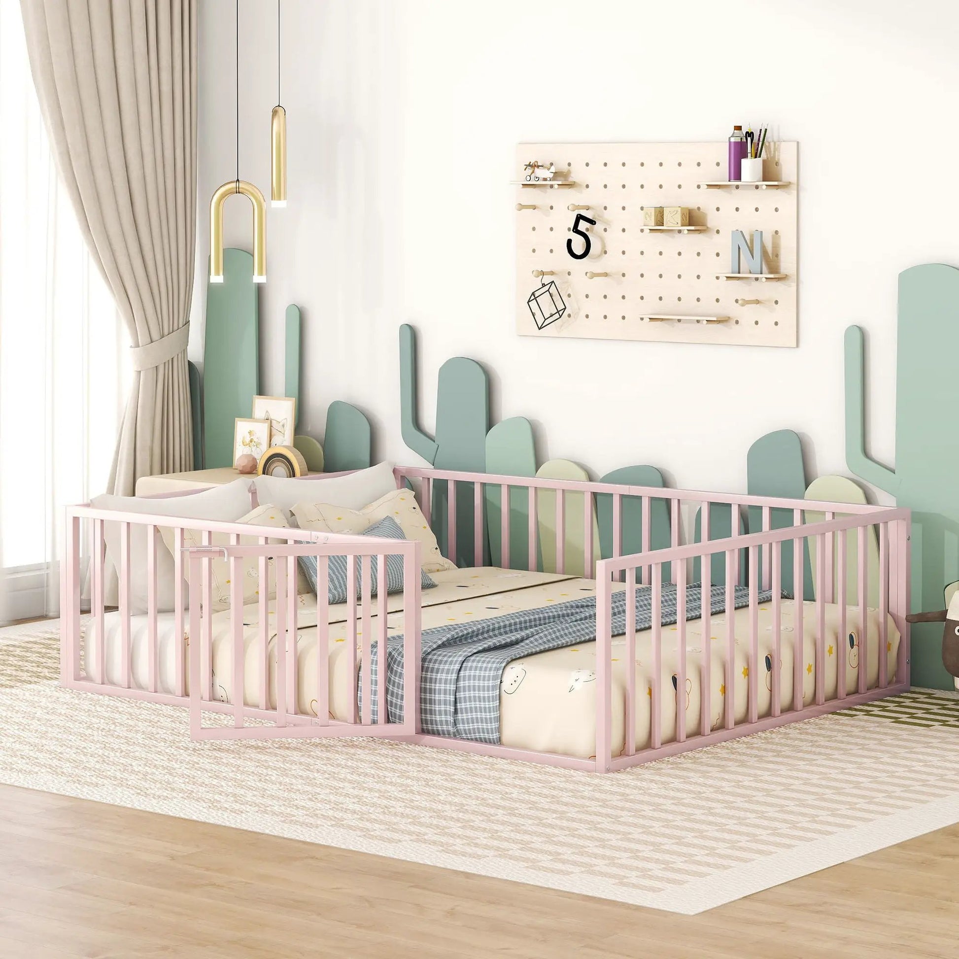 Metal floor bed frame with fence and door, pink finish, 2 beds shown in pastel nursery on Tampa Home & Garden Store