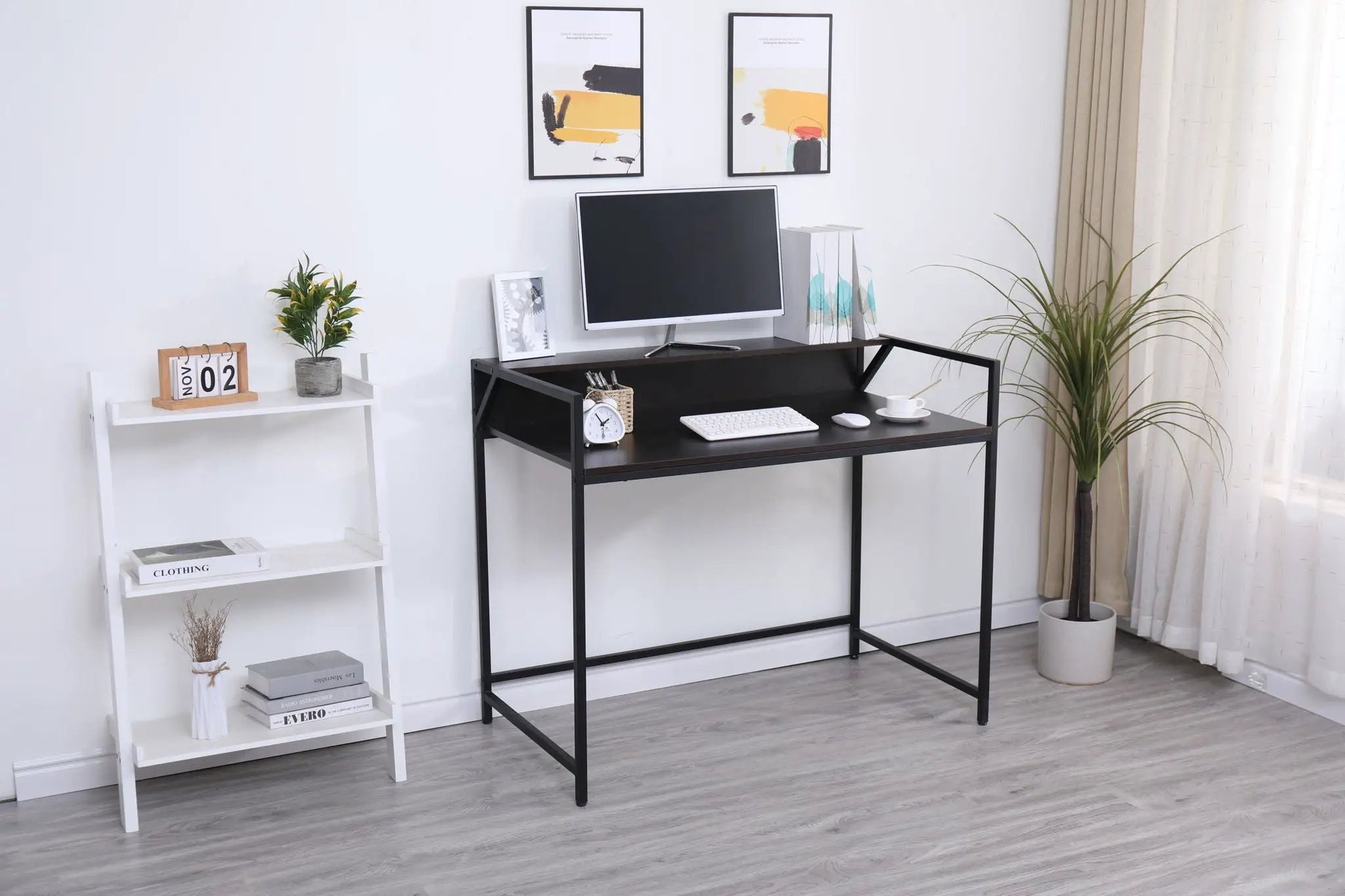Console table narrow black metal frame with monitor setup in a modern entryway living room on Tampa Home & Garden Store