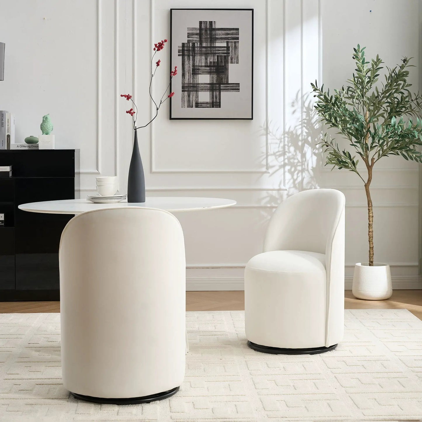 Pair of white 360 Degree Swivel Armless Dining Barrel Chairs with black bases on Tampa Home & Garden Store