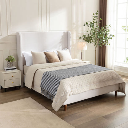 Harper tall upholstered bed with high beige headboard and neutral bedding on Tampa Home & Garden Store