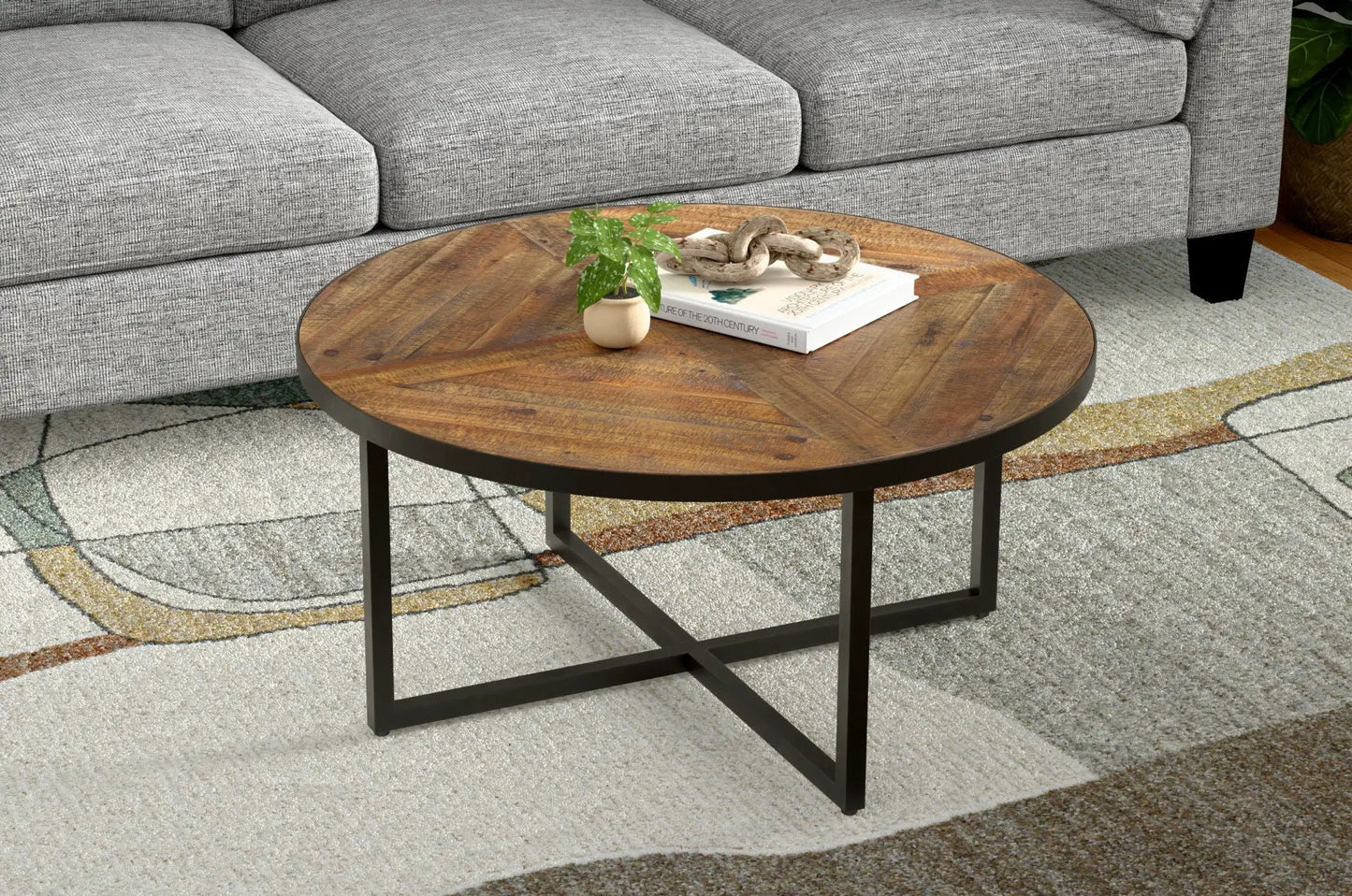 Faro round coffee table by Unique Piece Furniture with a warm wood top and black metal legs on Tampa Home & Garden Store