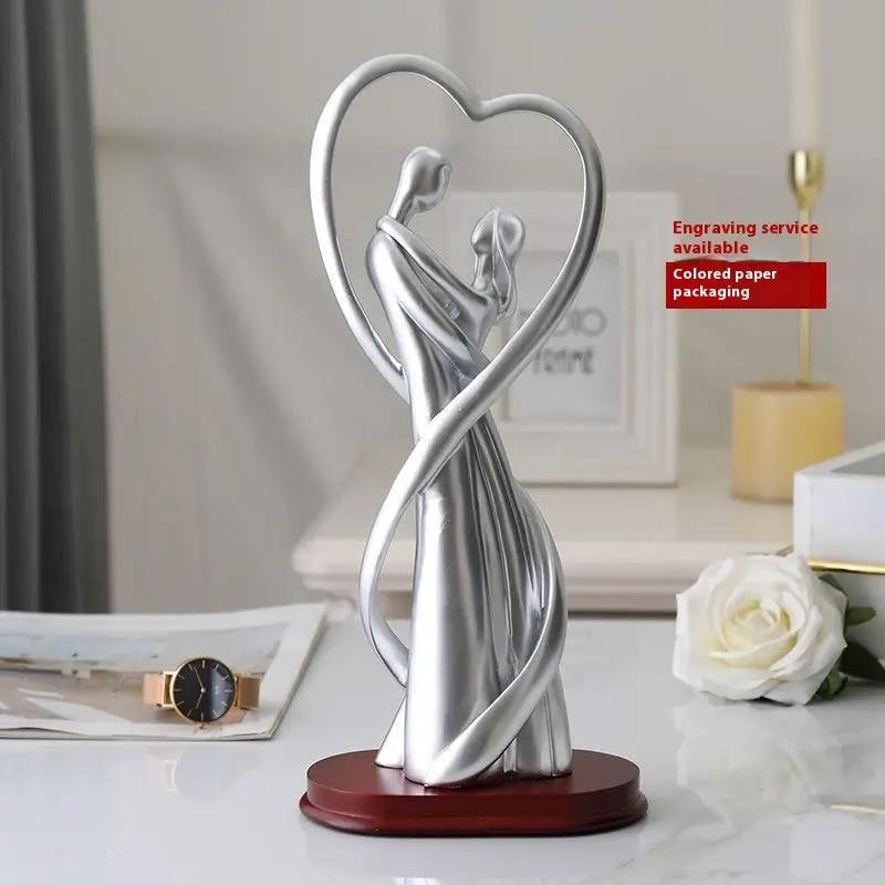Valentine's Day couple sculpture in silver with heart frame on wood base on Tampa Home & Garden Store