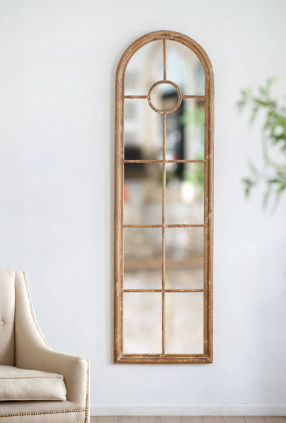 Arched mirror with distressed brown fir wood frame and circular window accent on Tampa Home & Garden Store