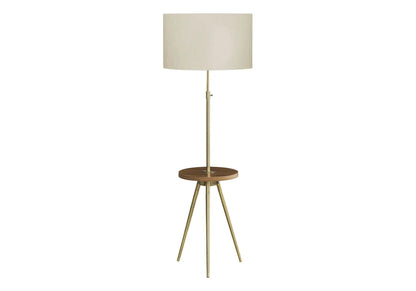 Floor lamp lighting with brass tripod base and beige fabric shade on Tampa Home & Garden Store