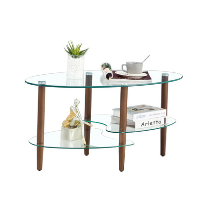 Oval transparent glass coffee table with oak wood legs and 3-tier shelves, plant and mug on top on Tampa Home & Garden Store
