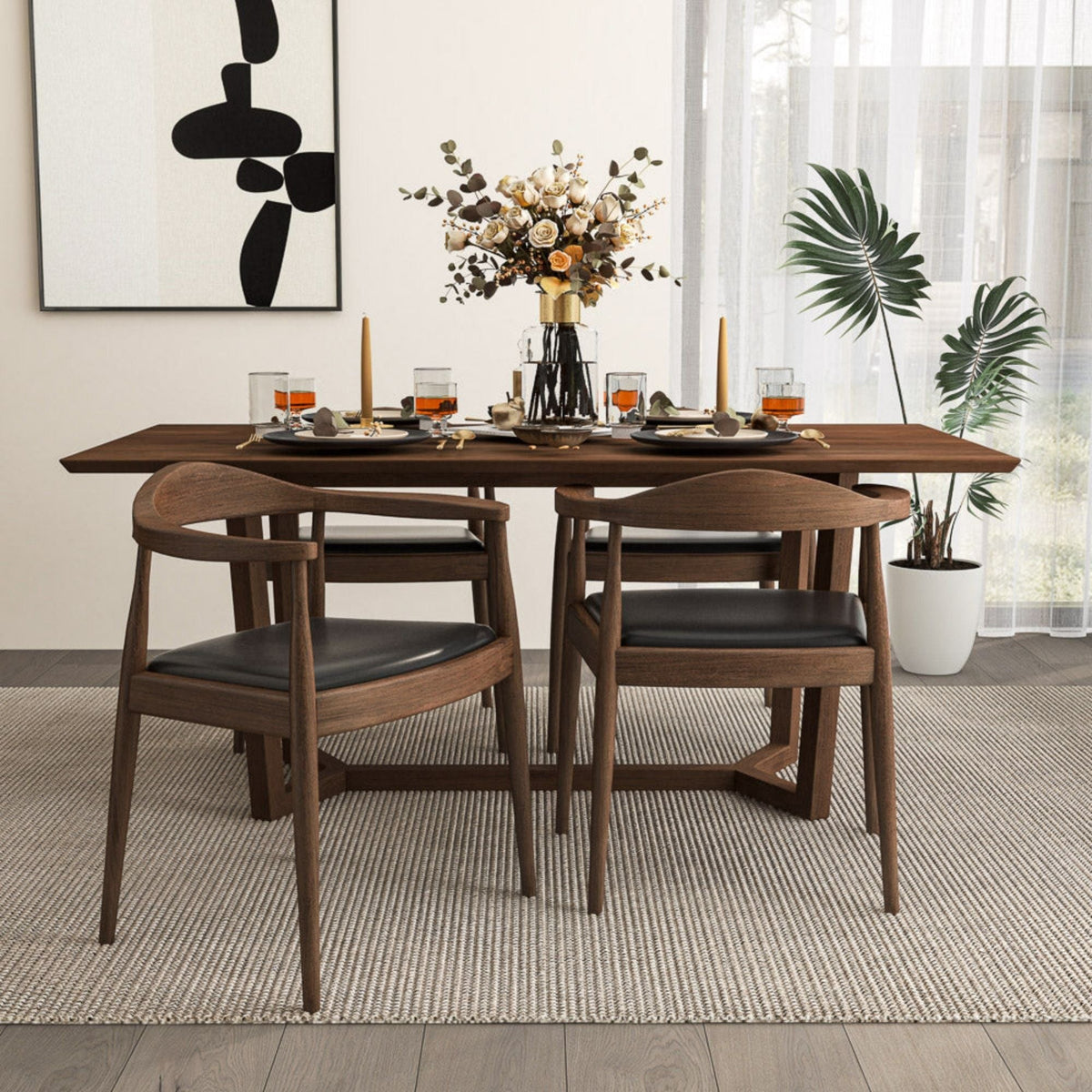 Mid-Century Modern dining chairs with armrests in dark brown wood and black cushioned seats on Tampa Home & Garden Store