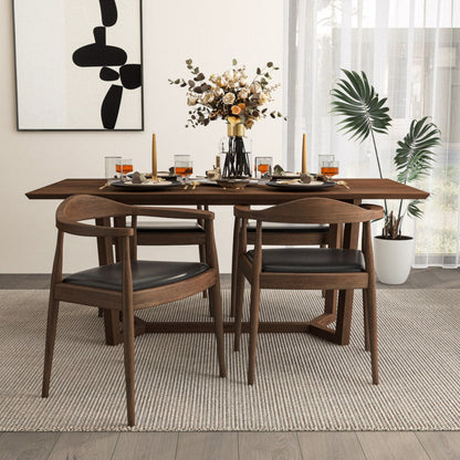 Mid-Century Modern dining chairs with armrests in dark brown wood and black cushioned seats on Tampa Home & Garden Store