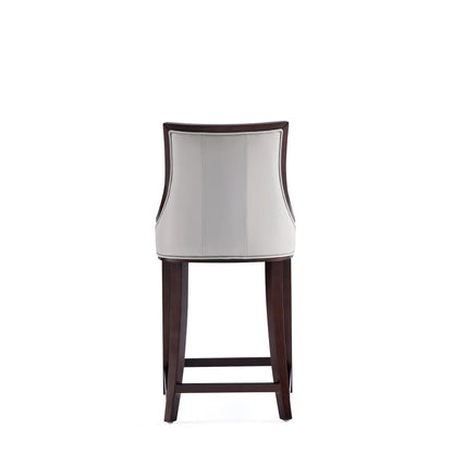 White bar-height stool with solid dark wood frame and curved white upholstered back on Tampa Home & Garden Store