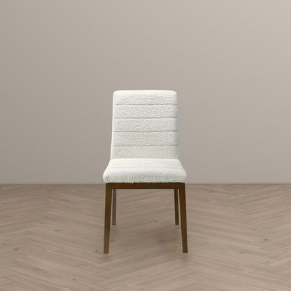 Modern dining chair with white fabric upholstery and solid wood base on Tampa Home & Garden Store