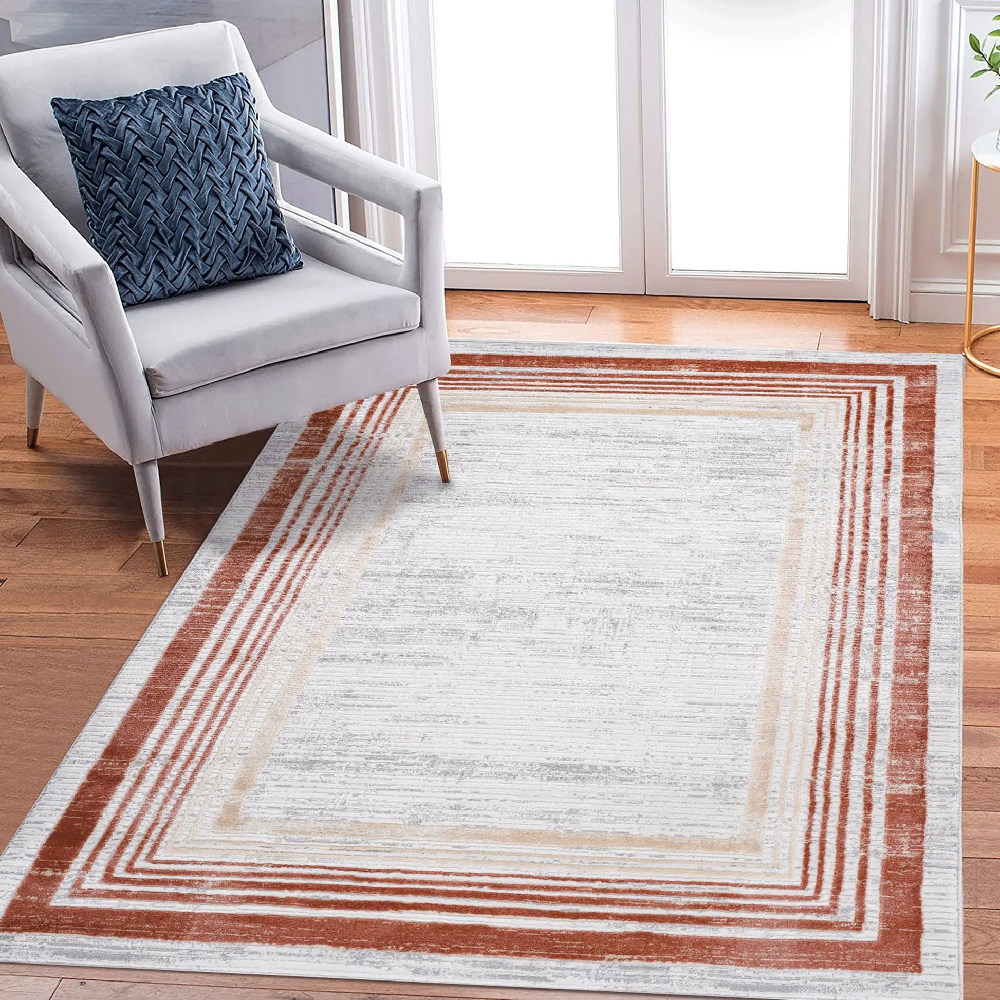 Marfi bordered area rug in light gray with rust border stripes by Unique Piece Furniture on Tampa Home & Garden Store