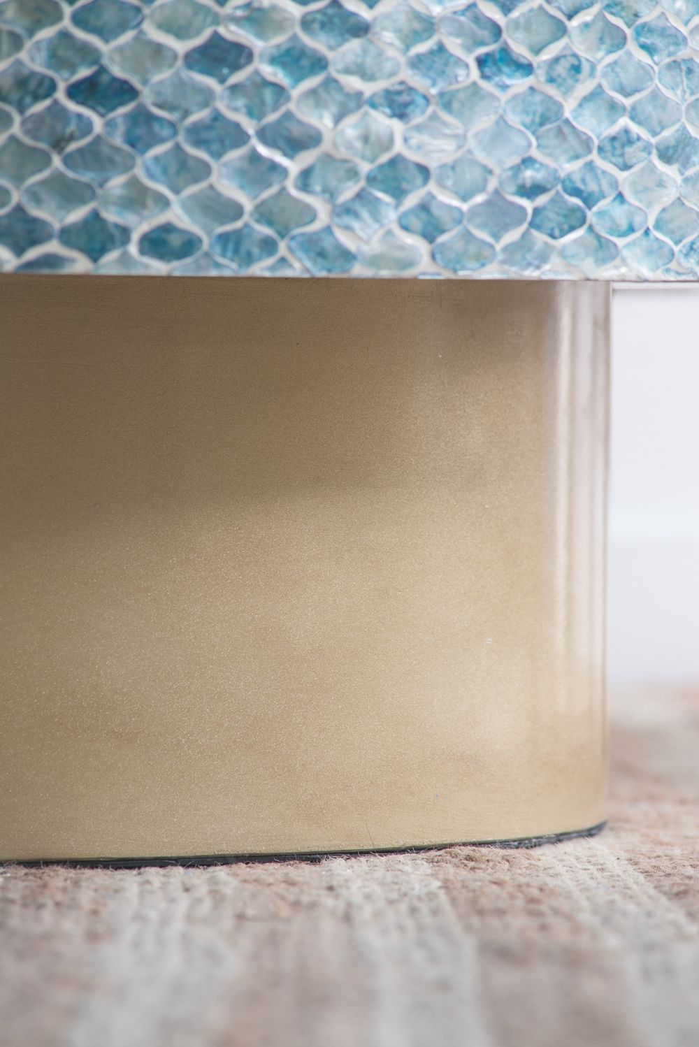 Capiz coffee table with brass pedestal base and blue mosaic top on Tampa Home & Garden Store