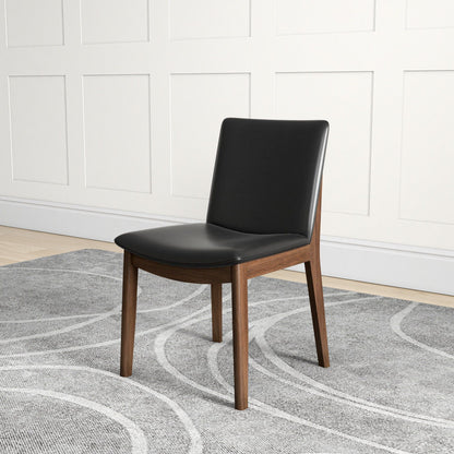 Mid-Century Modern dining chair with solid wood legs and black upholstered seat and back on Tampa Home & Garden Store