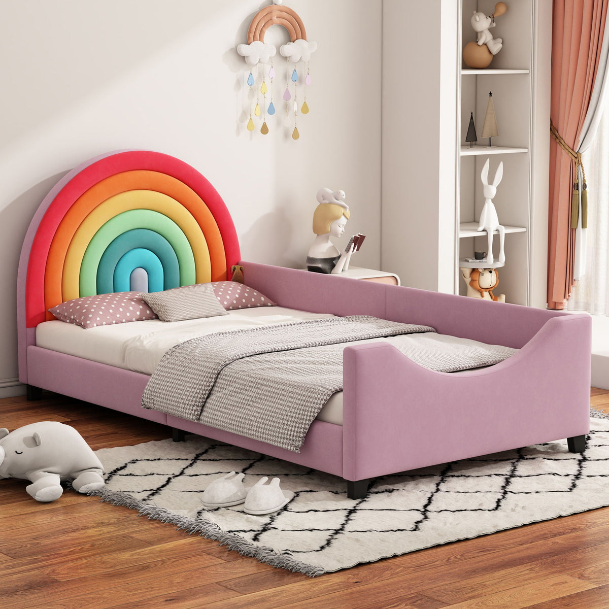 Rainbow twin daybed with a low pink frame and multicolor arch headboard in a kids room on Tampa Home & Garden Store