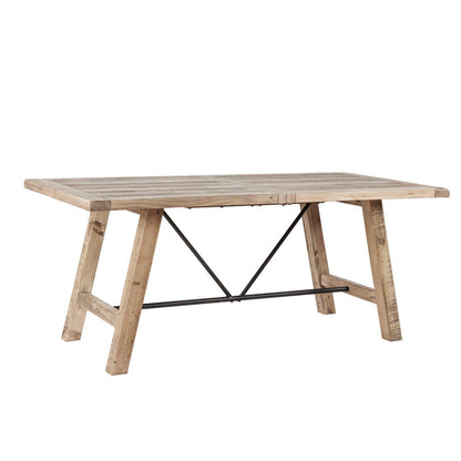 Rustic dining table in natural pine with black metal X-brace supports on Tampa Home & Garden Store