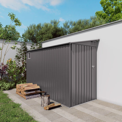 Gray lean-to storage shed with windows and sloped roof, vertical corrugated panels beside a wall on Tampa Home & Garden Store