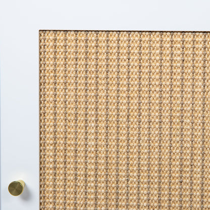 White interior door with brass knob beside beige woven jute rug on Tampa Home & Garden Store