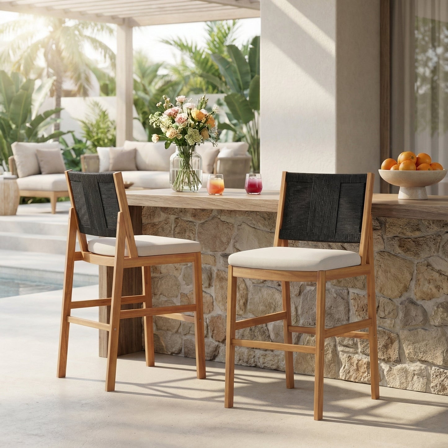 Outdoor Acacia Wood Bar Stools Set of 2 with beige cushions and black woven backs at a counter on Tampa Home & Garden Store