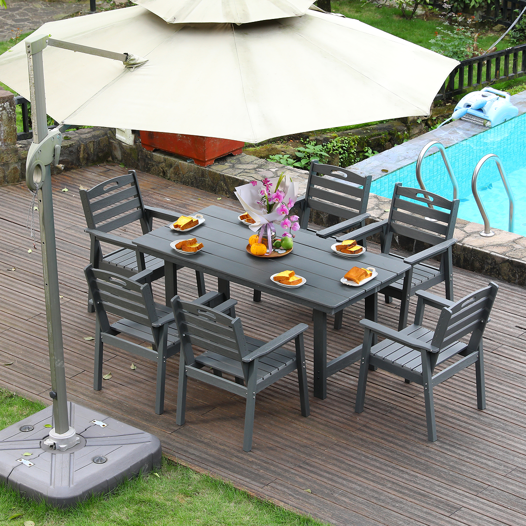 HDPE HouseOfZazla dining set with table and six chairs on a deck under umbrella by pool on Tampa Home & Garden Store