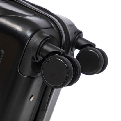 Black ABS spinner wheel on hard-shell luggage close-up from HouseOfZazla set on Tampa Home & Garden Store