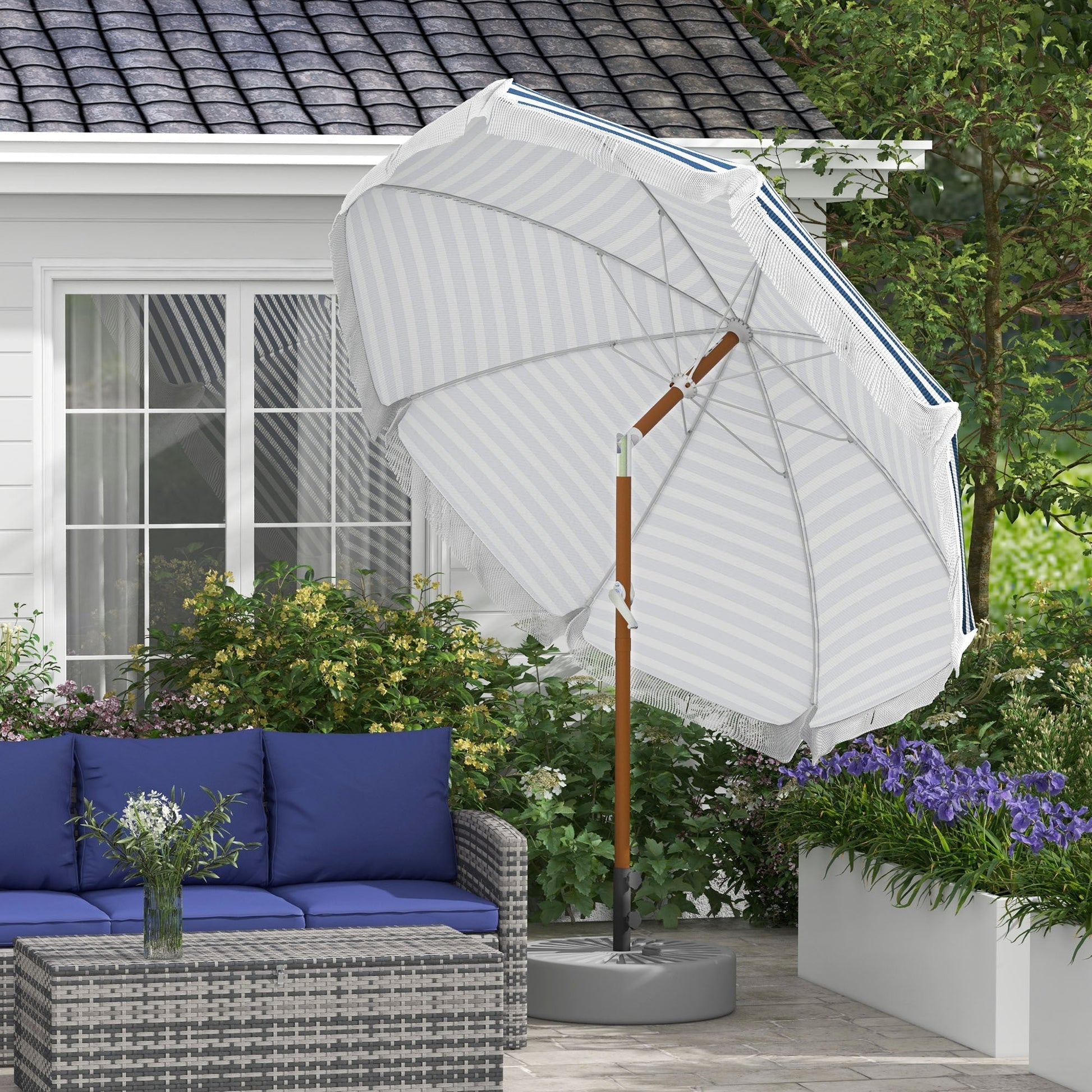 Outsunny 7x7 ft striped outdoor patio umbrella with tilt and vent over blue-cushioned wicker seating on Tampa Home & Garden Store