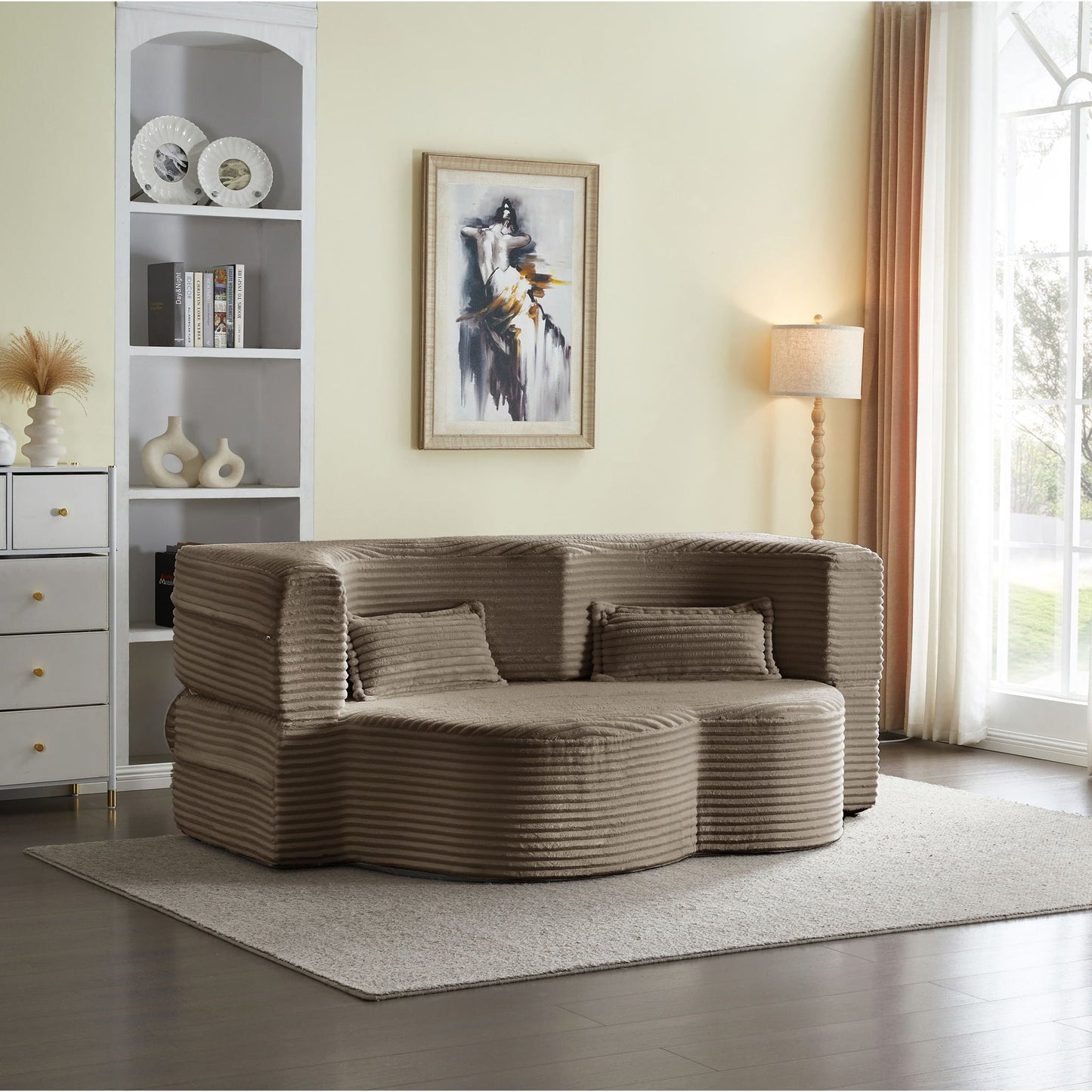 Floor convertible sleeper sofa bed with 2 pillows beige ribbed upholstery in a living room on Tampa Home & Garden Store