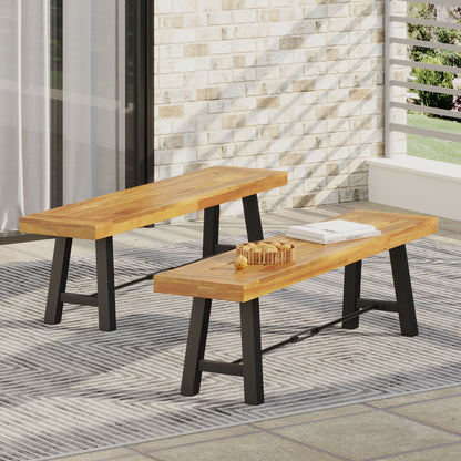 Catriona teak outdoor benches, two units, with black metal legs on a brick patio on Tampa Home & Garden Store