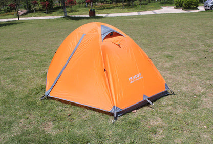 Camping tent Flyto orange dome on grass with grey poles and stakes on Tampa Home & Garden Store