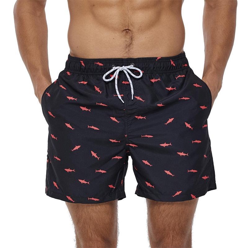 Stevvex quick-dry boardshorts navy with pink shark print, mesh lining, drawstring waist on Tampa Home & Garden Store